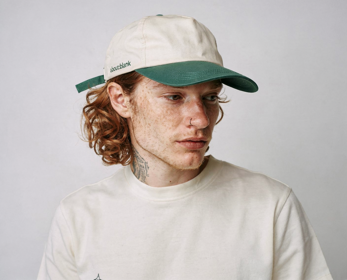 Portrait of a man in a cap and plain t-shirt