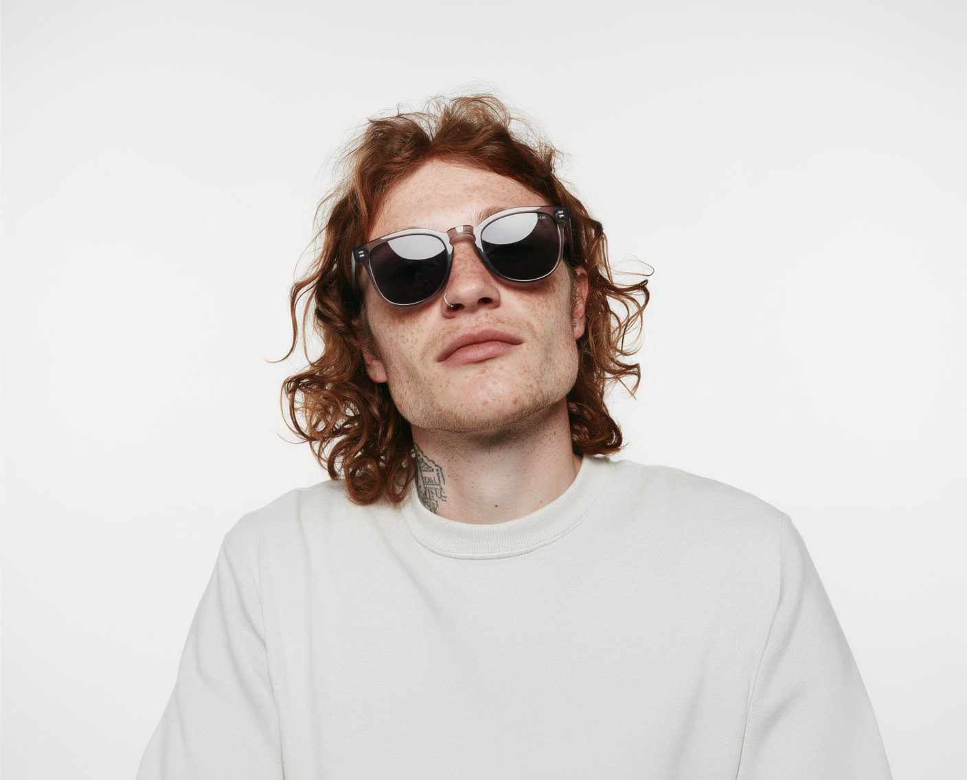 Portrait of a man wearing sunglasses and a sweatshirt
